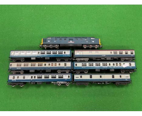 An 00 gauge British Rail express train consisting of Lima Deltic no 9006 "Fife and Forfar Yeomanry", and six blue-grey coache