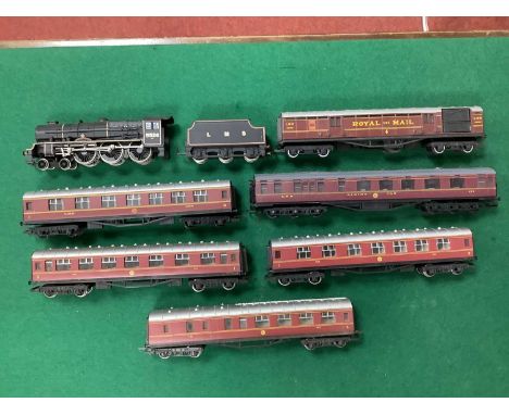 An 00 gauge LMS express train, comprising a Bachmann rebuilt "Patriot" no 5526 "Morecambe and Heysham" in post-war LMS black,