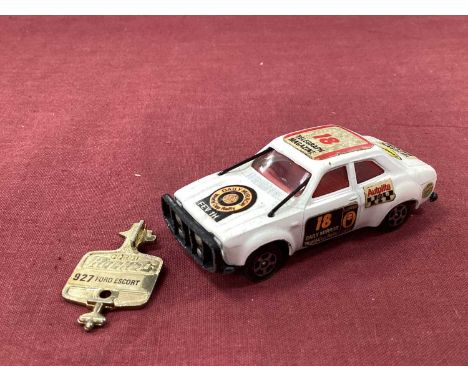 An Original 1970 Daily Mirror World Cup Rally Ford Escort and Key, overall good, stickers intact.