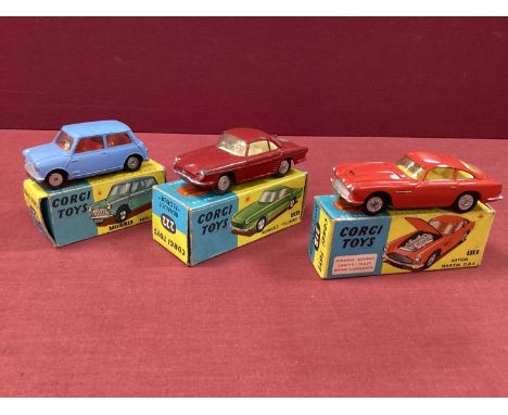 Three Original Corgi Toys No 218 Aston Martin DB4, Red No 222 Renault 'Floride', Maroon/ No 226 Morris Mini-Minor - blue, all