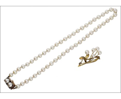 A cultured pearl necklace and spray brooch, the single uniform strand of cultured pearls to a twin cultured pearl set clasp w