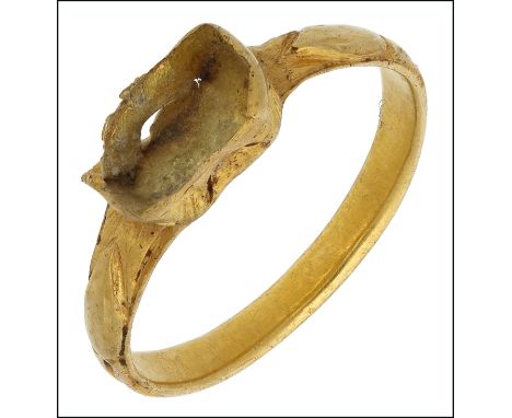 A 15th century gold ring, with vacant rectangular bezel, the shoulders with engraved leaf decoration, (damaged), ring size H.