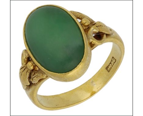 A jadeite ring, the jadeite cabochon collet set to foliate shoulders, yellow precious metal mounted with Chinese characters t