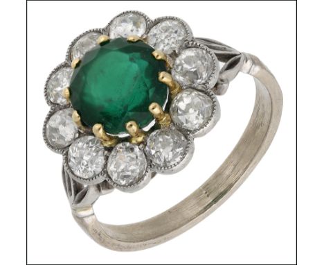 An emerald and diamond cluster ring, the central round mixed-cut emerald claw set within an old-cut diamond surround, millegr