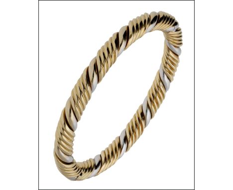 A two colour 18ct gold ropetwist hinged bangle, clasp bearing partial hallmark and maker’s mark ‘E.A.O.’, internal bangle wid