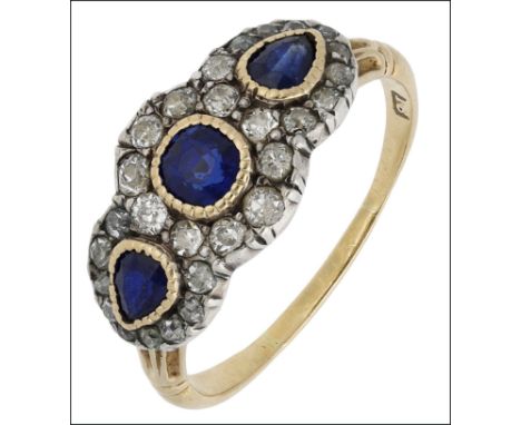 A triple sapphire and diamond cluster ring, comprising three sapphires in pinched collet settings within a surround of old-cu