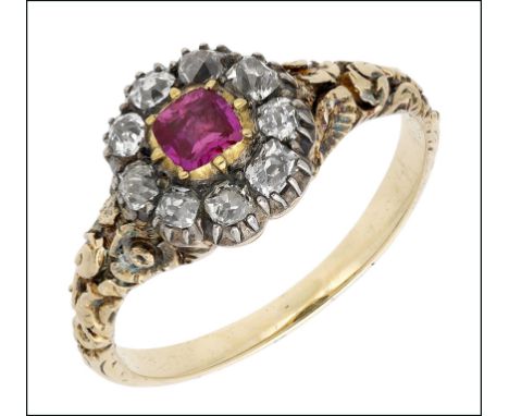 A 19th century Burmese pink sapphire and diamond cluster ring, silver and gold mounted, the cushion-cut pink sapphire in clos