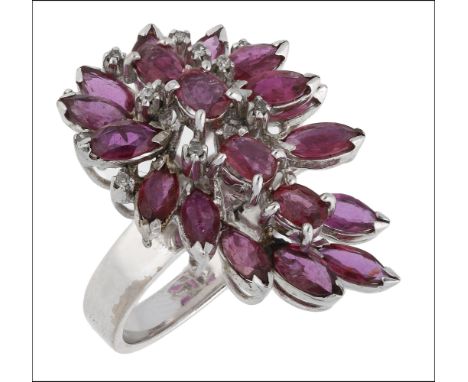 A ruby cluster dress ring, the asymmetric tiered cluster of claw set marquise and oval-cut rubies accented with small single-