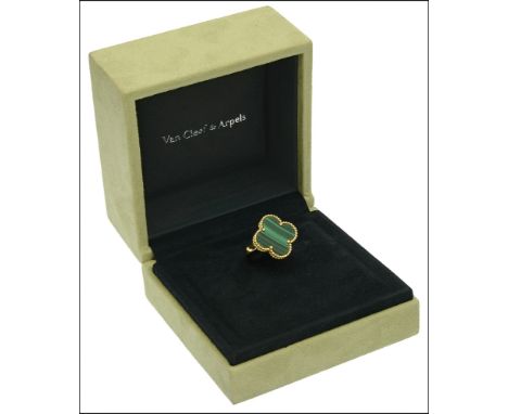 A malachite ‘Alhambra’ ring by Van Cleef & Arpels, the polished malachite quatrefoil within a beaded border and applied to a 