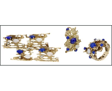 A lapis lazuli and opal suite, comprising a brooch, ring and single ear clip, of openwork abstract form, each piece claw set 