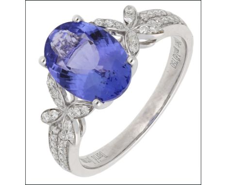 A tanzanite and diamond ring by David Jerome, the oval fancy-cut tanzanite of 2.47 carats, in four claw setting  between bril