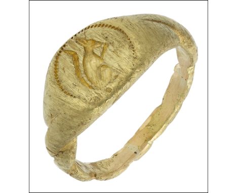 A late 15th/early 16th century gold seal ring, the oval-shaped bezel engraved with a squirrel sitting upright facing to the r