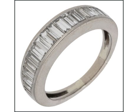 A diamond half eternity ring, the tapered band channel set with a graduated row of baguette-cut diamonds, stamped ‘750’, tota