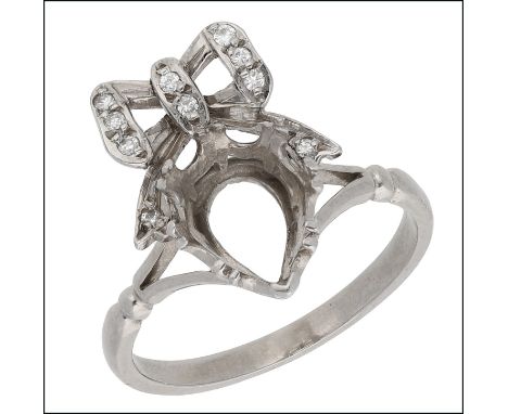 A diamond set ring mount, the vacant pear-shaped setting beneath a brilliant-cut diamond bow surmount, to bifurcated shoulder