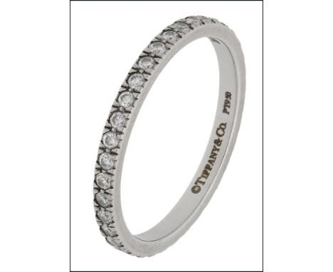 A diamond eternity ring by Tiffany & Co., set with a continuous row of brilliant-cut diamonds, mounted in platinum, signed ‘T