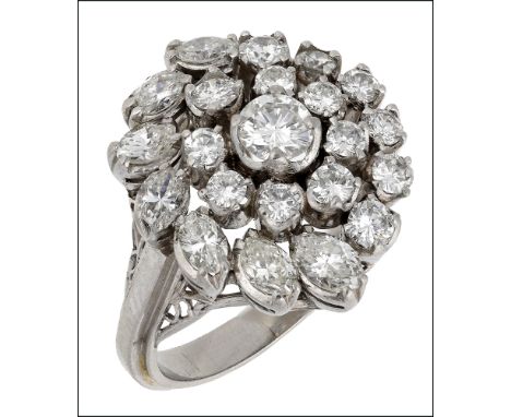 A diamond cluster ring, of swirl design, claw set with graduated brilliant and marquise-cut diamonds, indistinct assay marks,
