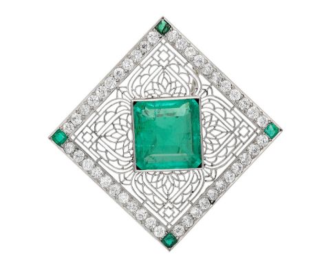 A Colombian emerald and diamond brooch, first quarter of the 20th century, set with a step-cut emerald within a knife-wire tr