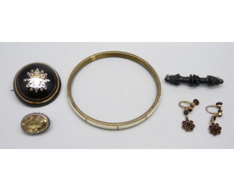 Jewellery comprising a tortoiseshell pique brooch, a pair of red stone earrings, a jet brooch, a silver citrine brooch and a 