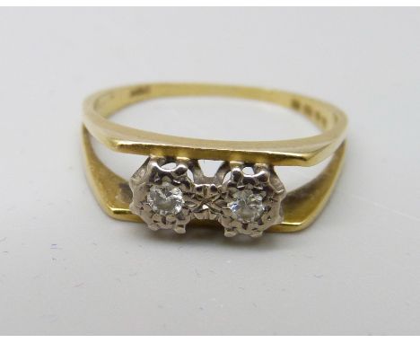 An 18ct gold and two stone diamond ring, 2.2g, J 