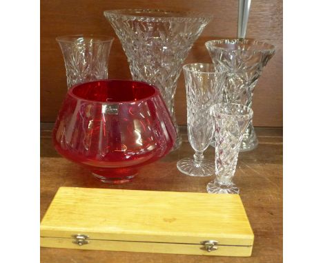 A collection of five Waterford lead crystal vases, a set of Leerdam crystal knife rests and a Dartington ruby crystal bowl/va