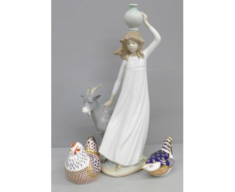 Two Royal Crown Derby paperweights and a Nao figure of a girl with goat 