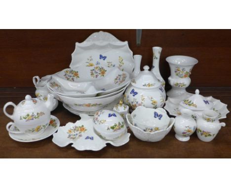 A collection of early Aynsley Cottage Garden china, includes shell shaped dish, three lidded pots, two small bells, tea for o