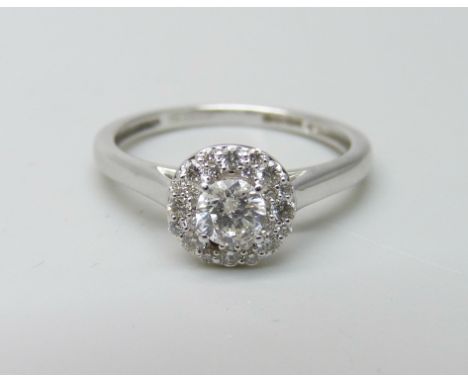 An 18ct white gold and diamond ring, 0.5ct total diamond weight marked on the shank, 2.7g, M, lacking one small diamond 