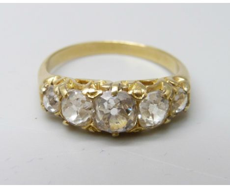 A yellow metal ring, (tests as 18ct gold), set with five old-cut diamonds on a double strand D-section shank, diamonds estima