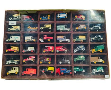 DISPLAY CASE WITH MODEL WAGONS 