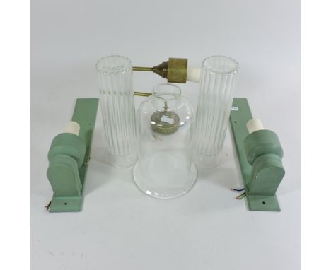 A pair of Jim Lawrence verdigris wall lights, 33cm tall, together with another wall light 