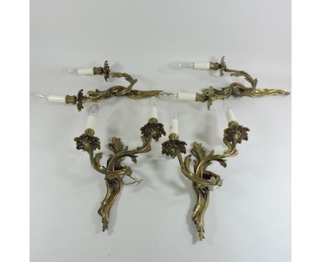 A set of four gilt bronze ornate wall lights 