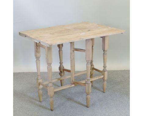 An antique pine gate leg table, 90cm