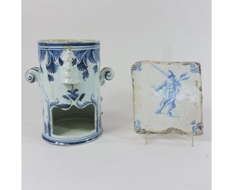 A Delft pottery candle holder, 17cm tall, together with a tile