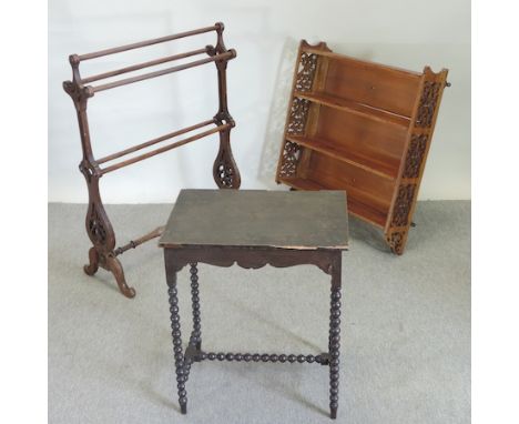 A Victorian walnut fret carved three tier wall shelf, 76cm, together with a towel airer and an oak occasional table (3)