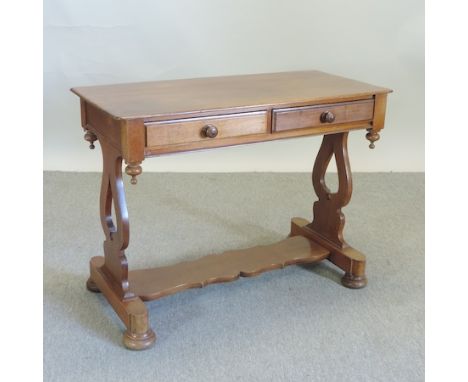 A Victorian mahogany sofa table, containing a pair of frieze drawers, on a stretcher base, 98cm