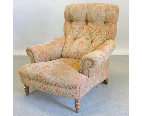 A Victorian style floral upholstered button back armchair