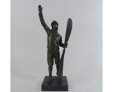 A bronze figure of pilot