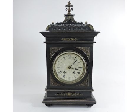 A 19th century continental ebonised and gilt metal mounted bracket clock, with a silvered dial, striking on a gong, 51cm tall