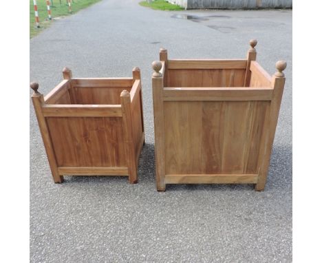 A teak planter, 66cm tall, together with another smaller