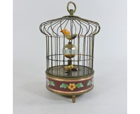 A reproduction automaton bird cage clock, 23cm tall
