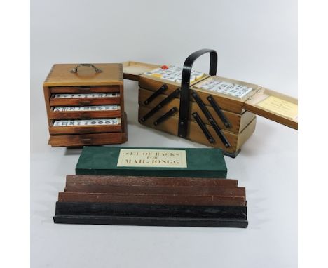 A Mahjong set, in a fitted box, together with another set and various tile holders 