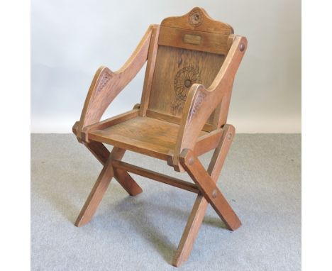 An early 20th century light oak Glastonbury chair