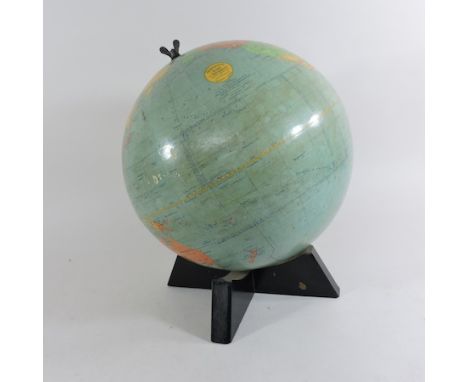 A terrestrial globe, by W. & A. K. Johnston, Edinburgh, on stand, 38cm tall overall