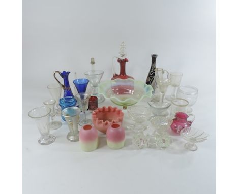 A collection of glass to include a vaseline lamp shade, rinsers, a Loetz style vase, and 19th century drinking glasses 