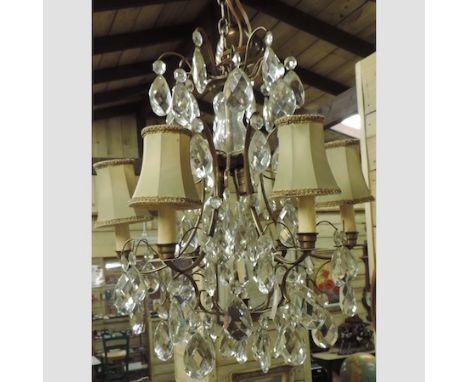 A brass and cut glass six branch chandelier, 50cm diameter, together with a brass standard lamp with a white glass shade 