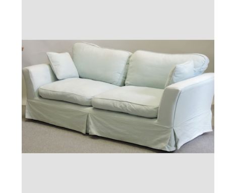 A modern pale blue upholstered three seater sofa, 210cm