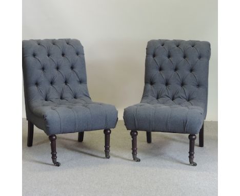 A pair of contemporary grey upholstered button back side chairs 