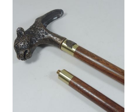 A walking stick, in two sections, the handle in the form of a cheetah head, cased