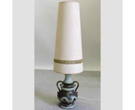 A 1960's pottery table lamp and shade, 128cm tall