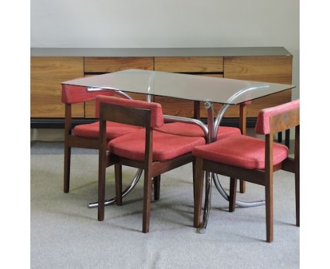 A 1970's teak and ebonised sideboard,198cm together with a tubular chrome glass top dining table and a set of four Stagg dini